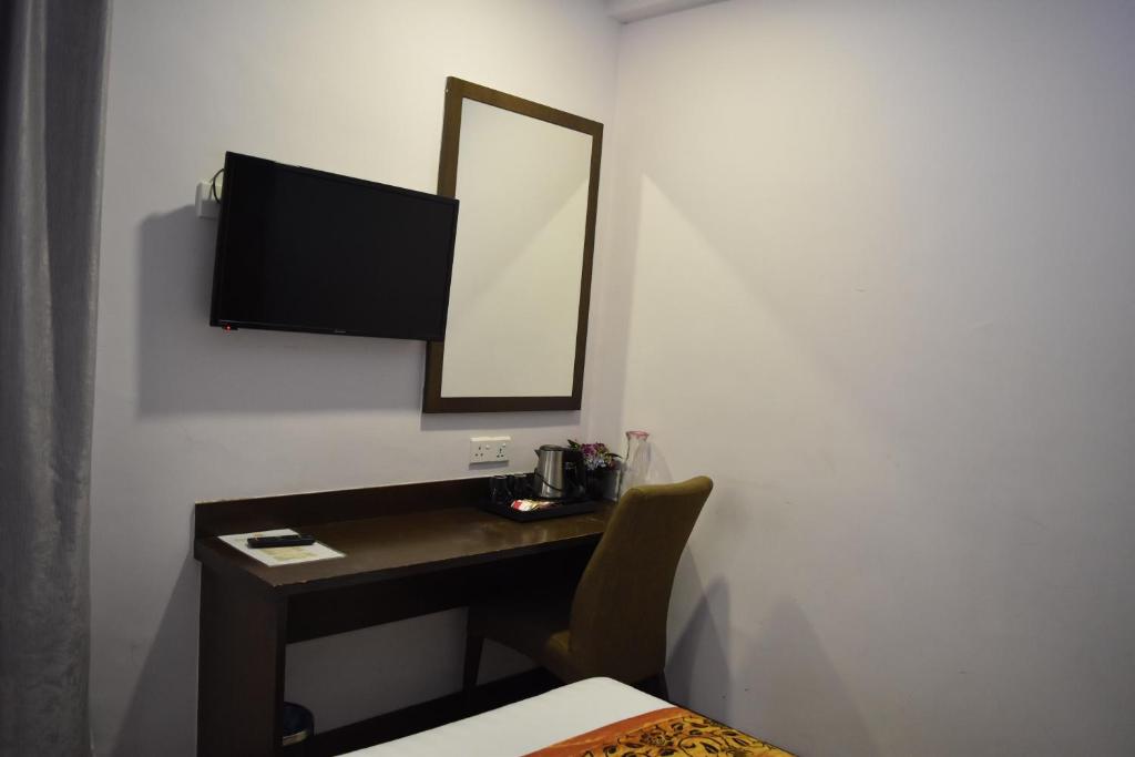 TV a/nebo společenská místnost v ubytování Sunrise Hotel