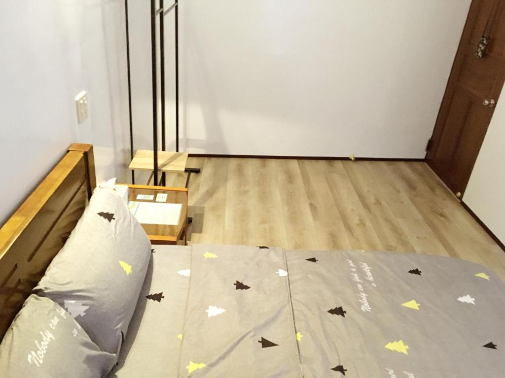 Postel nebo postele na pokoji v ubytování 瑞恒行館Reui Heng Guesthouse