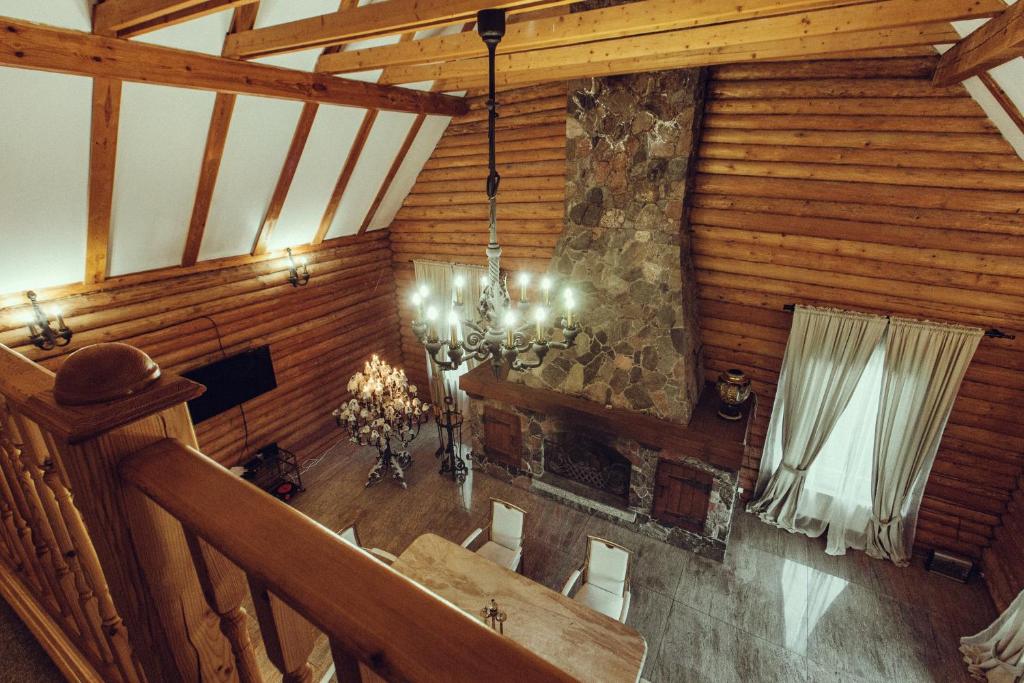 an overhead view of a dining room in a cabin at Candle House in Padure