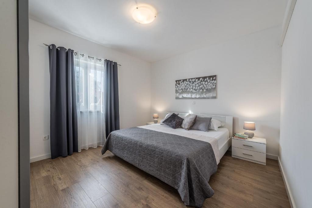 Posteľ alebo postele v izbe v ubytovaní Holiday Home Bajlo apartment with three bedrooms