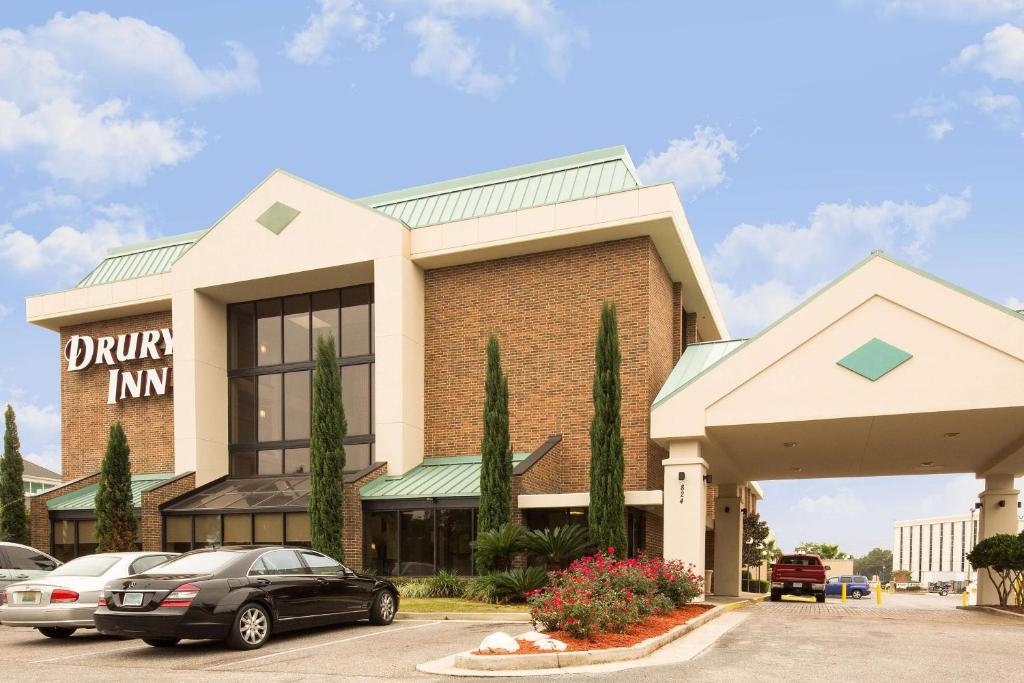 a car parked in front of a building at Drury Inn - Mobile in Mobile