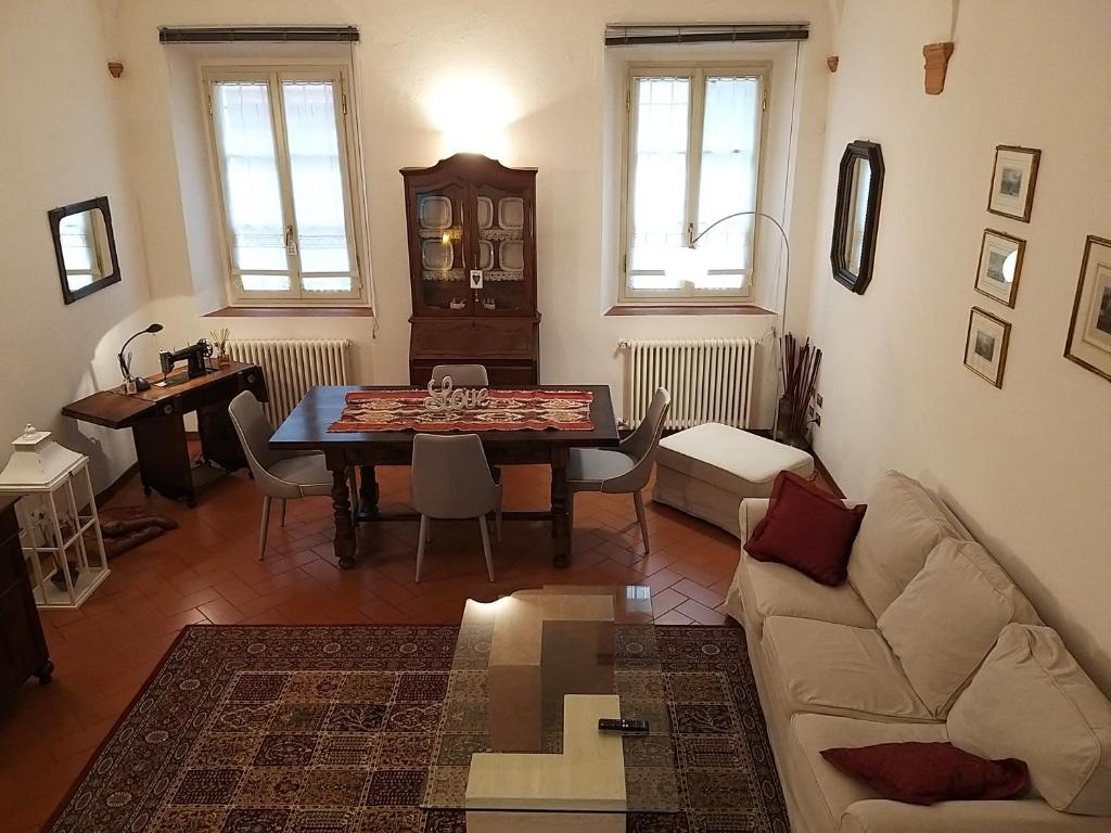a living room with a table and a couch at Sweet Home in Imola