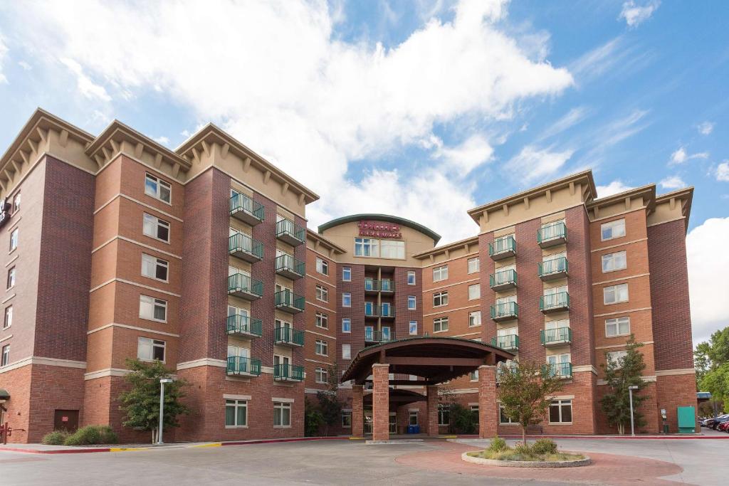 a large building with a clock on the front of it at Drury Inn & Suites Flagstaff in Flagstaff