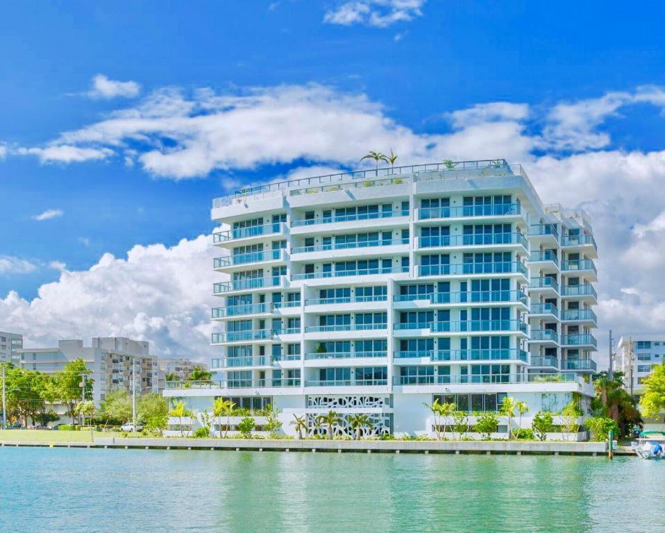 a large building in the middle of a lake at Ivory On The Bay in Miami Beach