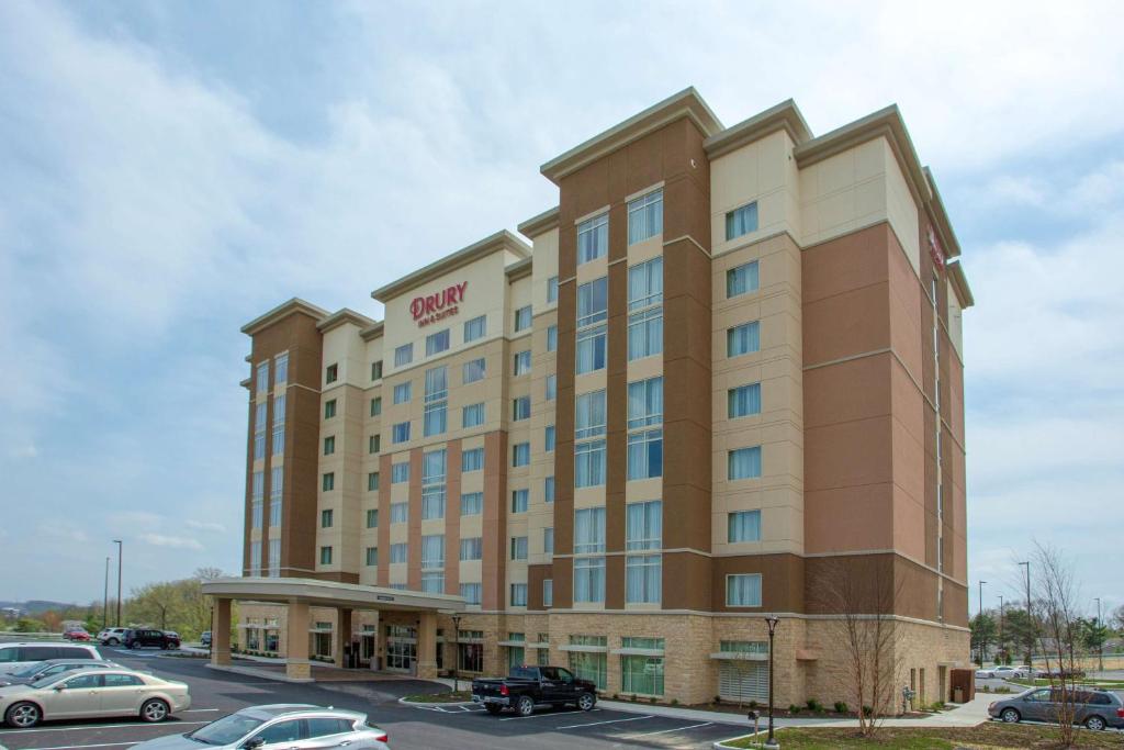 a large building with a large clock on the side of it at Drury Inn & Suites Pittsburgh Airport Settlers Ridge in Pittsburgh