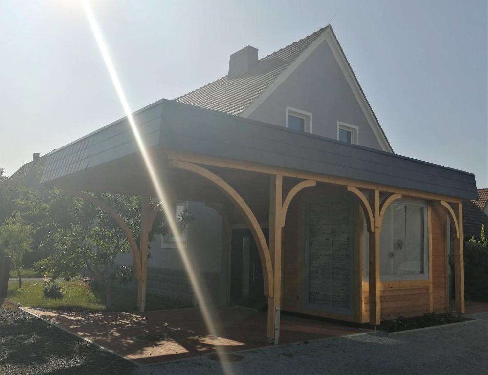 a house with a large gazebo at Ferienhaus Niesky in Niesky