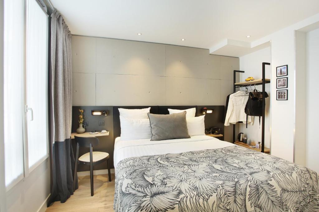 Postel nebo postele na pokoji v ubytování Le Basile Hôtel