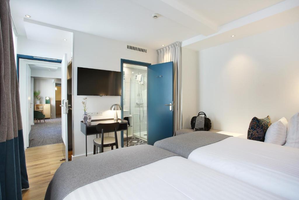 Postel nebo postele na pokoji v ubytování Le Basile Hôtel