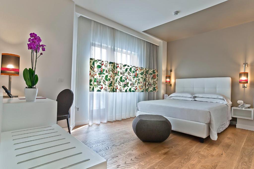Postel nebo postele na pokoji v ubytování Hotel Caravel