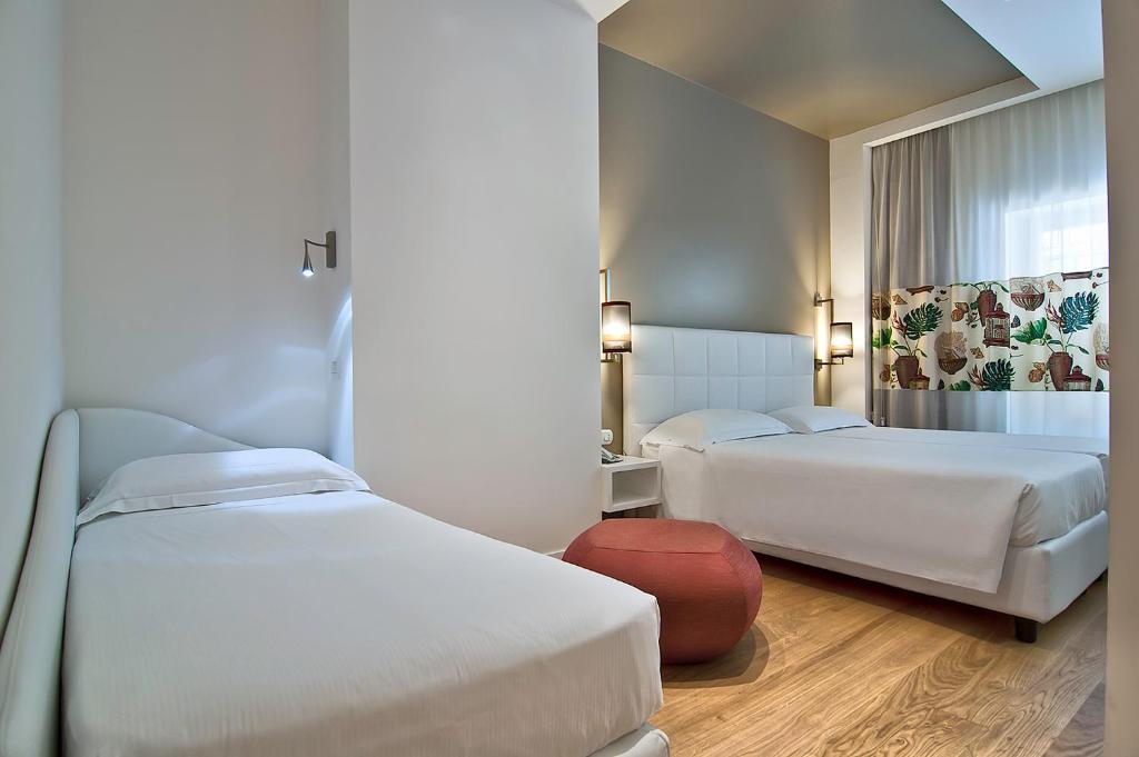 Postel nebo postele na pokoji v ubytování Hotel Caravel