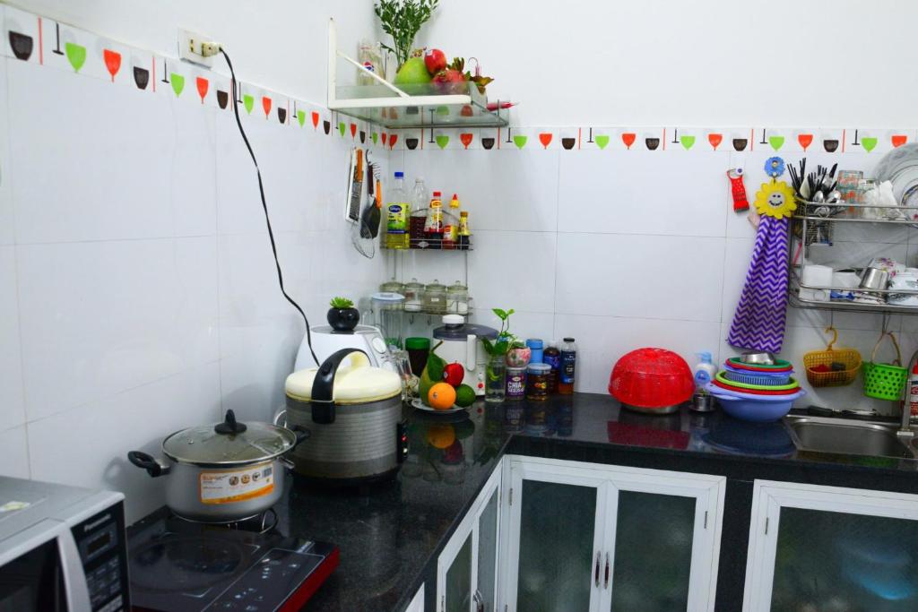 Kuchyň nebo kuchyňský kout v ubytování Blossom Homestay