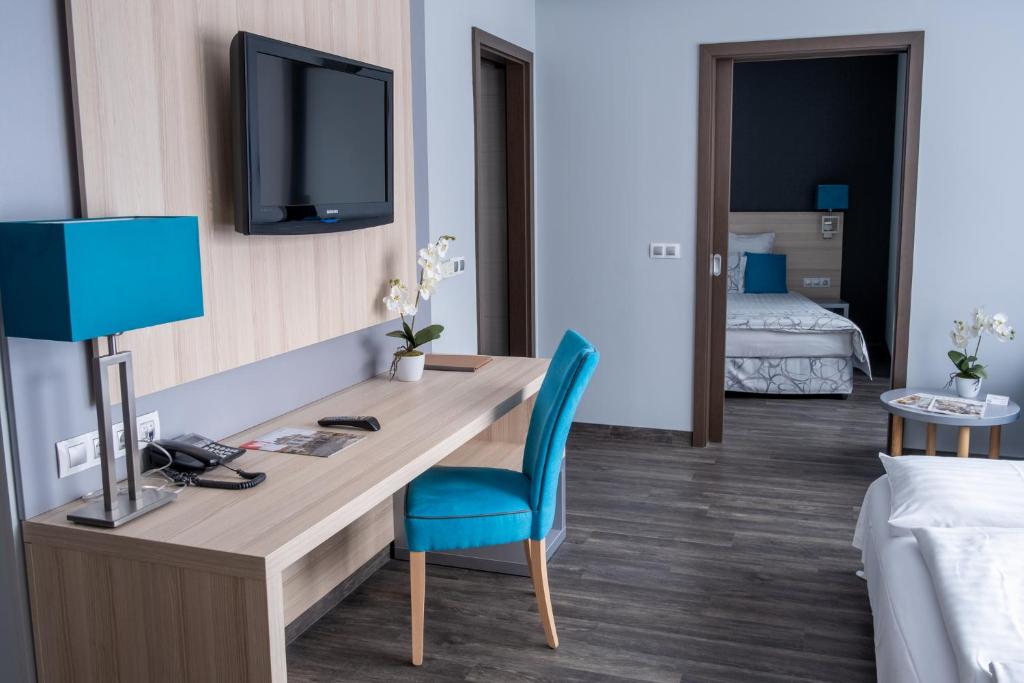 Postel nebo postele na pokoji v ubytování Hotel Regnum Residence
