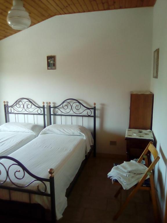 Postel nebo postele na pokoji v ubytování B&B Isabella
