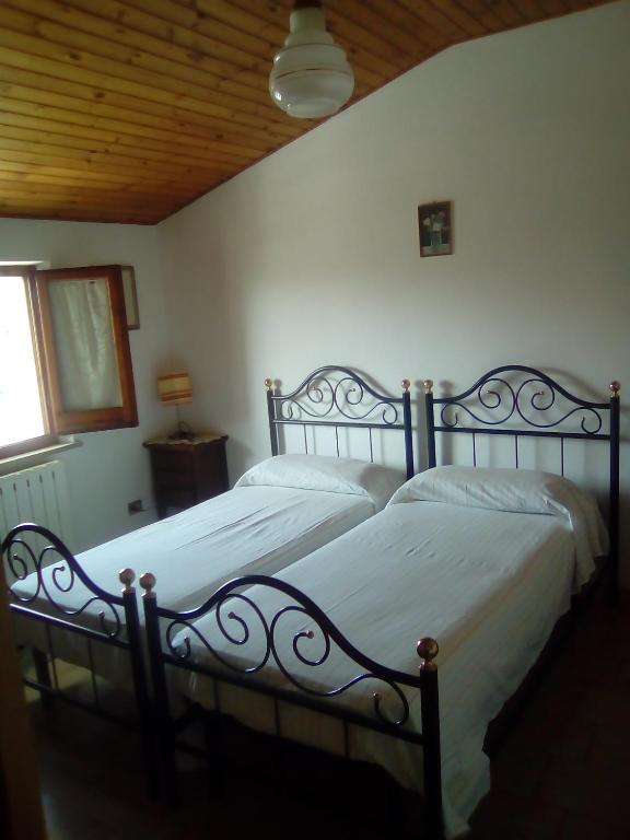 Postel nebo postele na pokoji v ubytování B&B Isabella