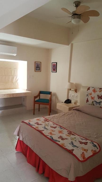 Postel nebo postele na pokoji v ubytování Hotel y Suites Nader