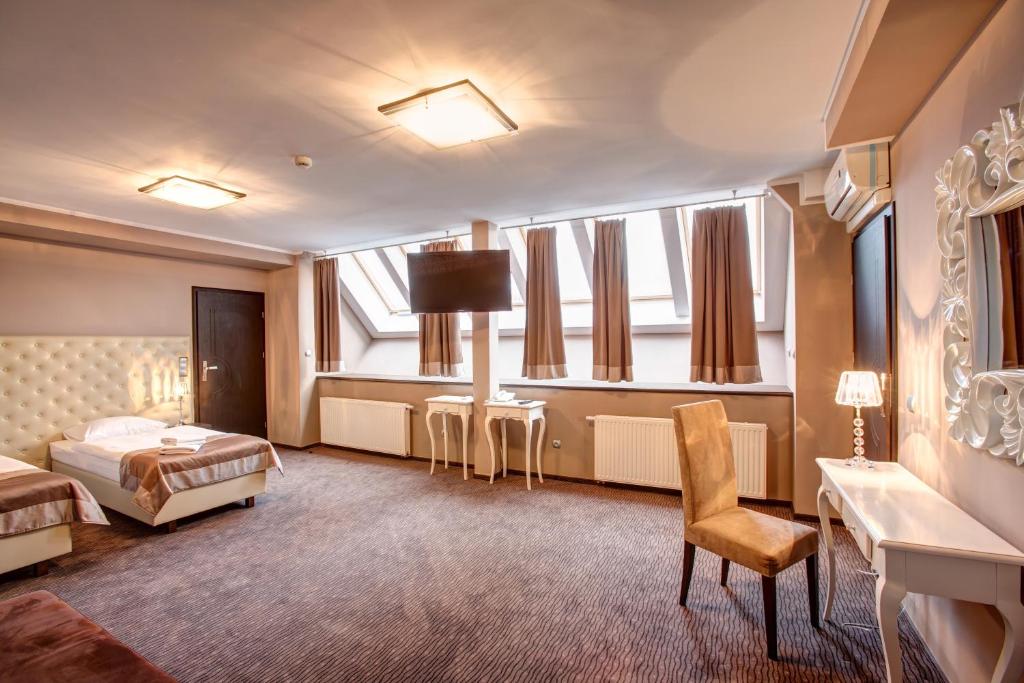 Posteľ alebo postele v izbe v ubytovaní Hotel Jedlinka