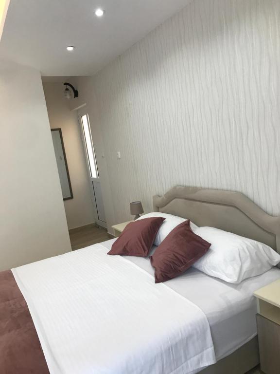 Postel nebo postele na pokoji v ubytování Apartments Ada Bojana