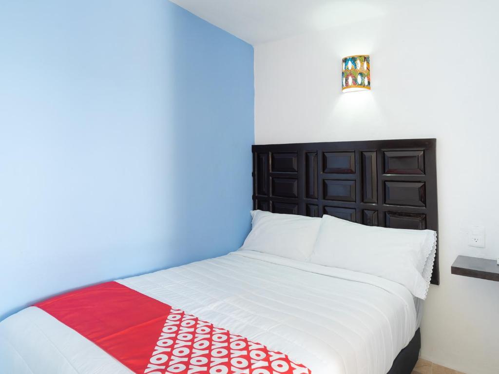 Postel nebo postele na pokoji v ubytování Hotel Casa Poblana