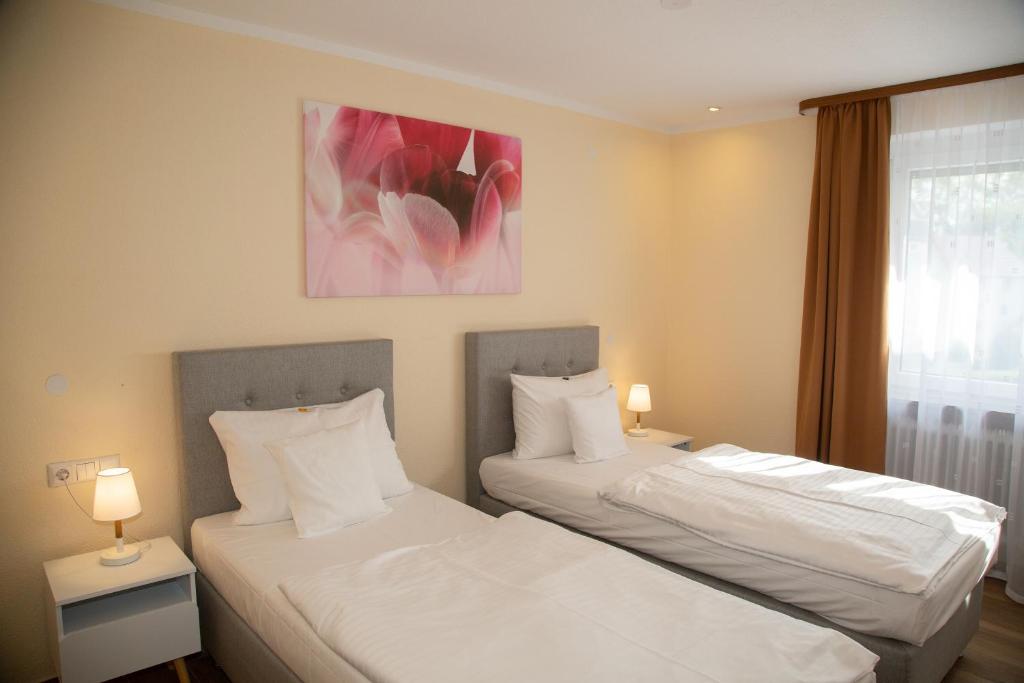 Postel nebo postele na pokoji v ubytování Hotel Andrea