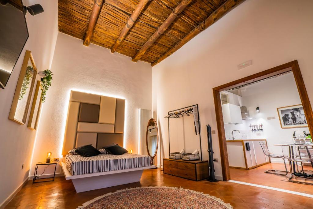 a bedroom with a bed and a mirror at Vinto House Salerno Old Town in Salerno