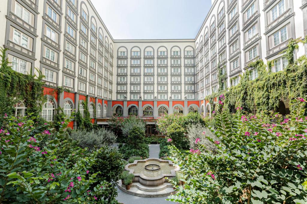 a large building with a garden in front of it at Four Seasons Hotel Mexico City in Mexico City
