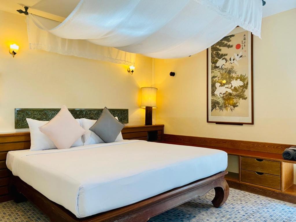 Postel nebo postele na pokoji v ubytování Aochalong Villa Resort & Spa - SHA Plus