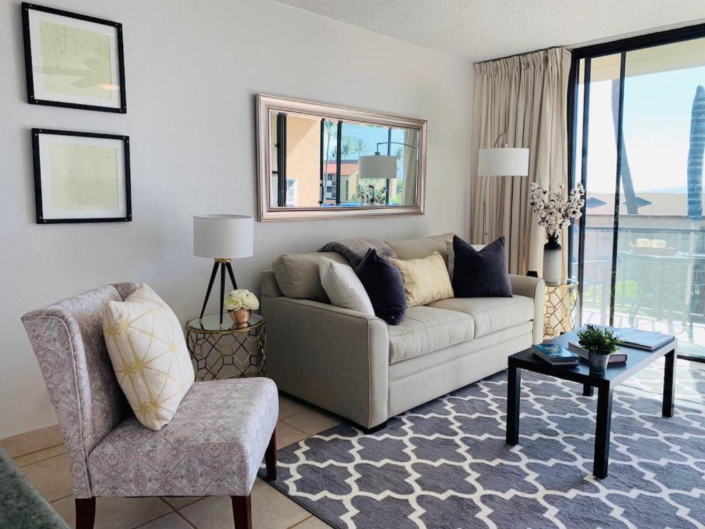 a living room with a couch and a chair at 1BD Condo with Ocean Views: 40% OFF, Self Check-In in Kihei