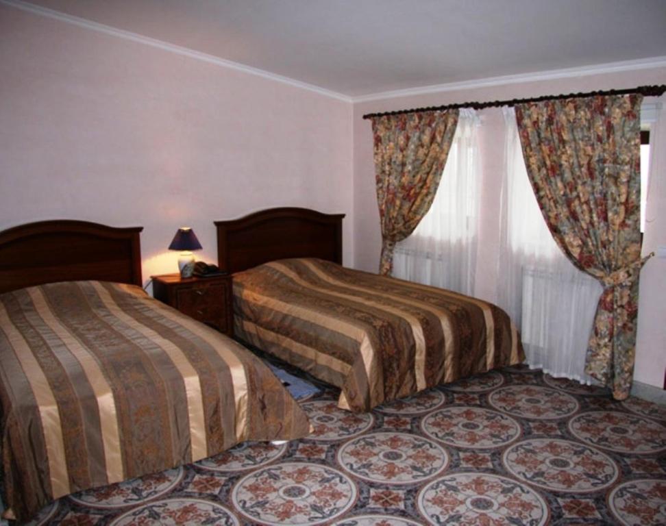 Postel nebo postele na pokoji v ubytování Giuseppe Hotel