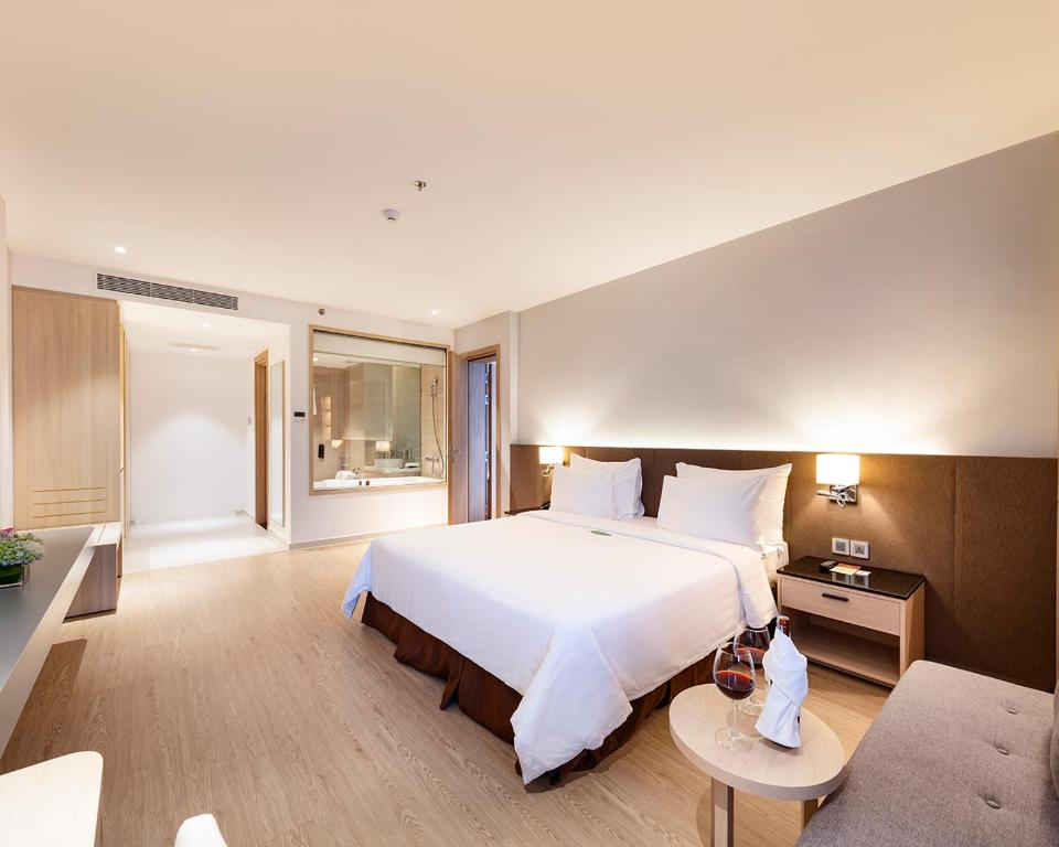 Postel nebo postele na pokoji v ubytování DQua Hotel