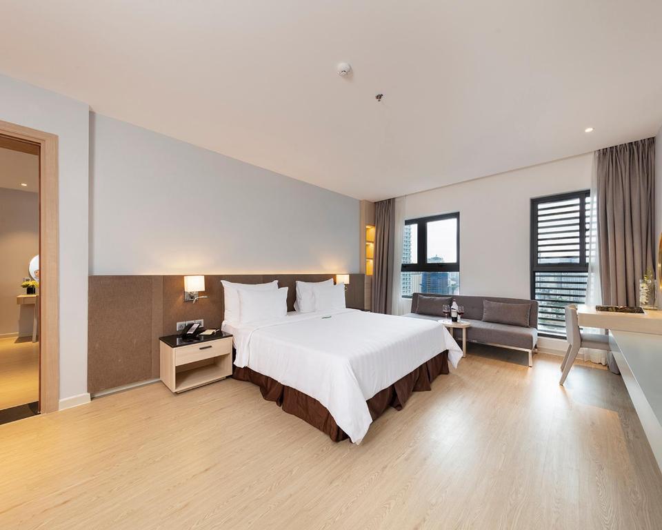 Postel nebo postele na pokoji v ubytování DQua Hotel