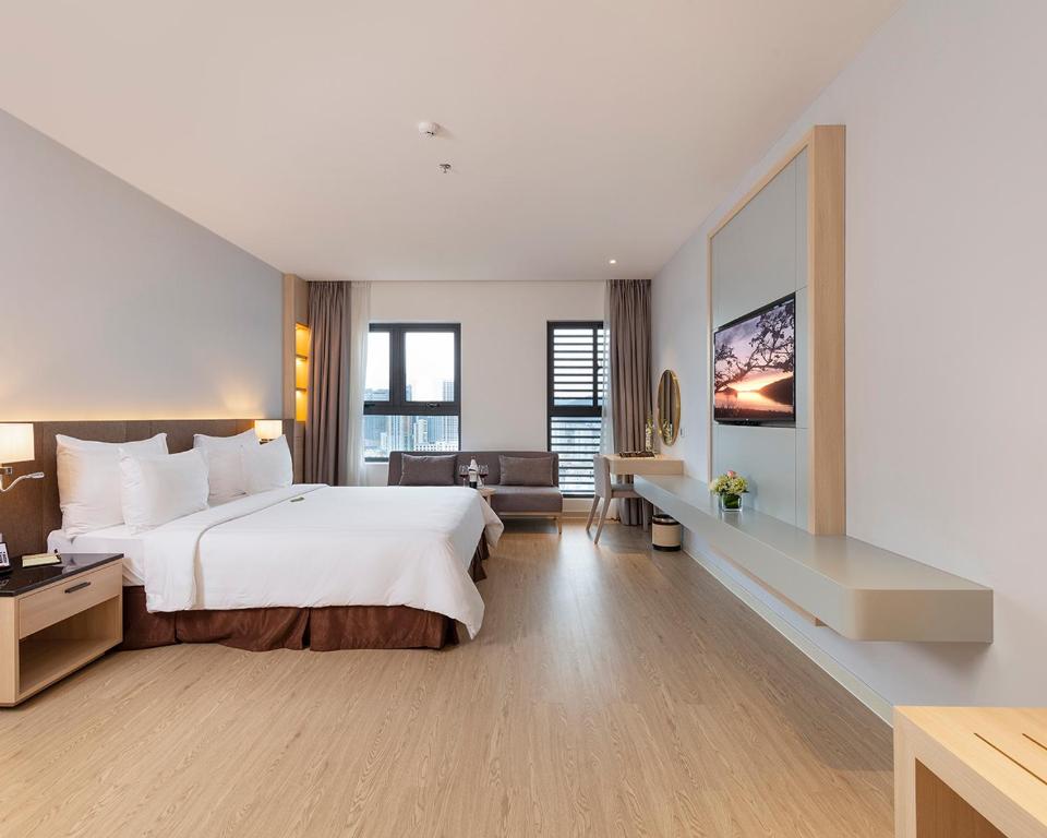 Postel nebo postele na pokoji v ubytování DQua Hotel