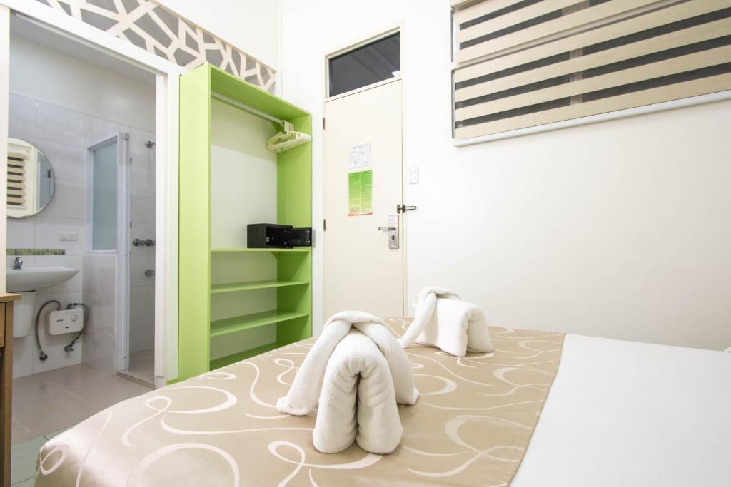 Postel nebo postele na pokoji v ubytování Alicia Tower Residences