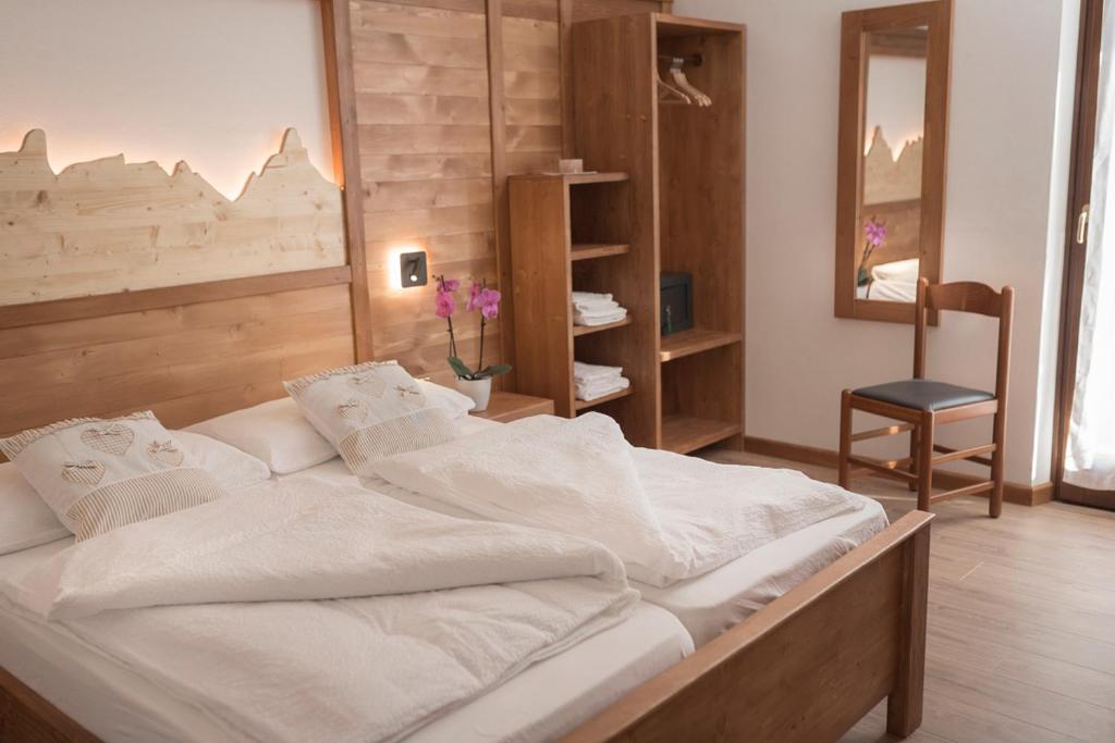 Postel nebo postele na pokoji v ubytování Garni Le Prealpi