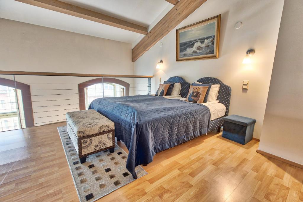 Postel nebo postele na pokoji v ubytování Daily Apartments - Antique style loft