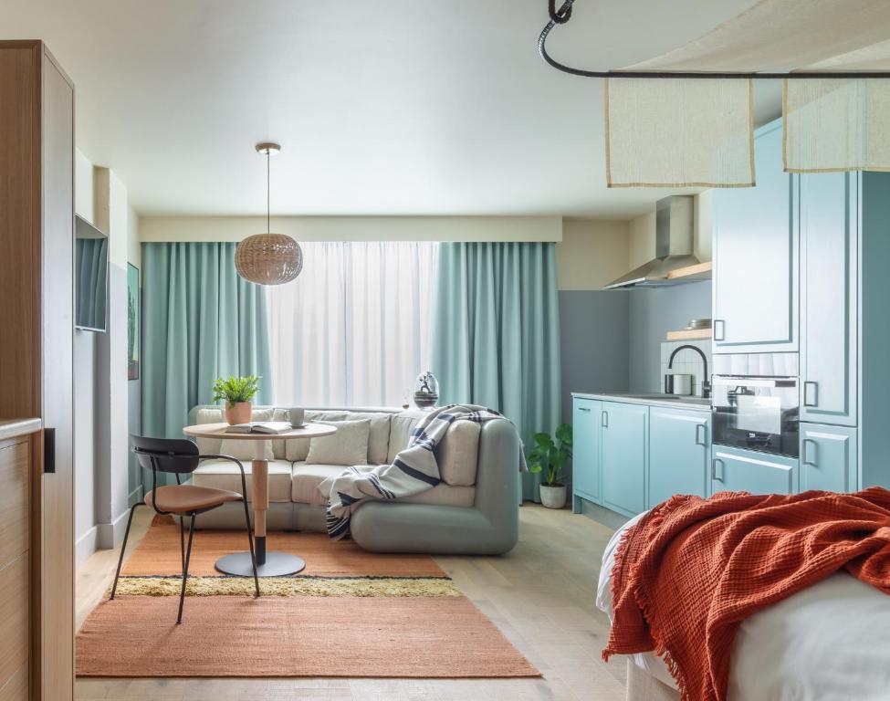 a living room with a couch and a table at Bermonds Locke in London