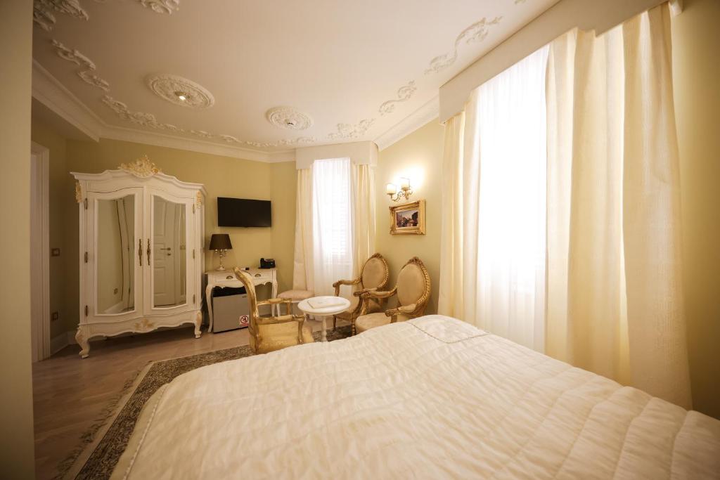 Postel nebo postele na pokoji v ubytování Palazzo Venezia-Adults Only