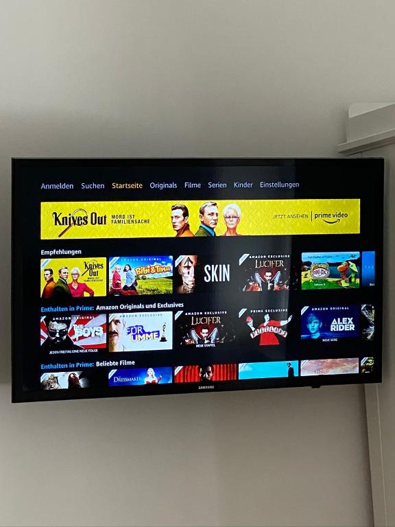 TV a/nebo společenská místnost v ubytování Palais Gutenberg le Petit
