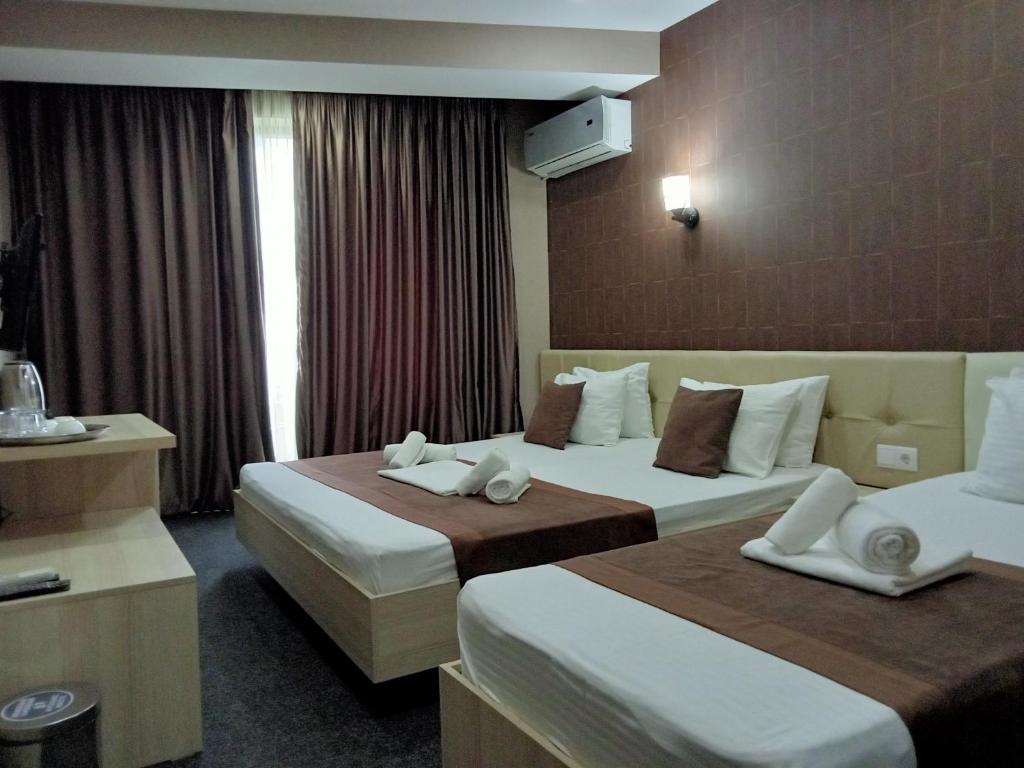 Postel nebo postele na pokoji v ubytování Hotel Voyager