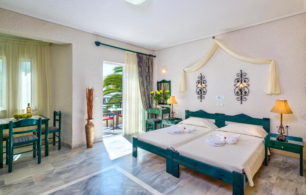 Postel nebo postele na pokoji v ubytování Hotel Castle Suites