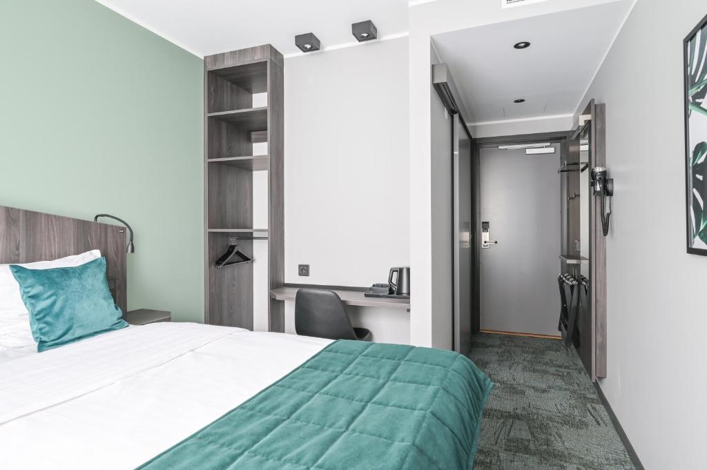 Postel nebo postele na pokoji v ubytování Hotel Fridhem