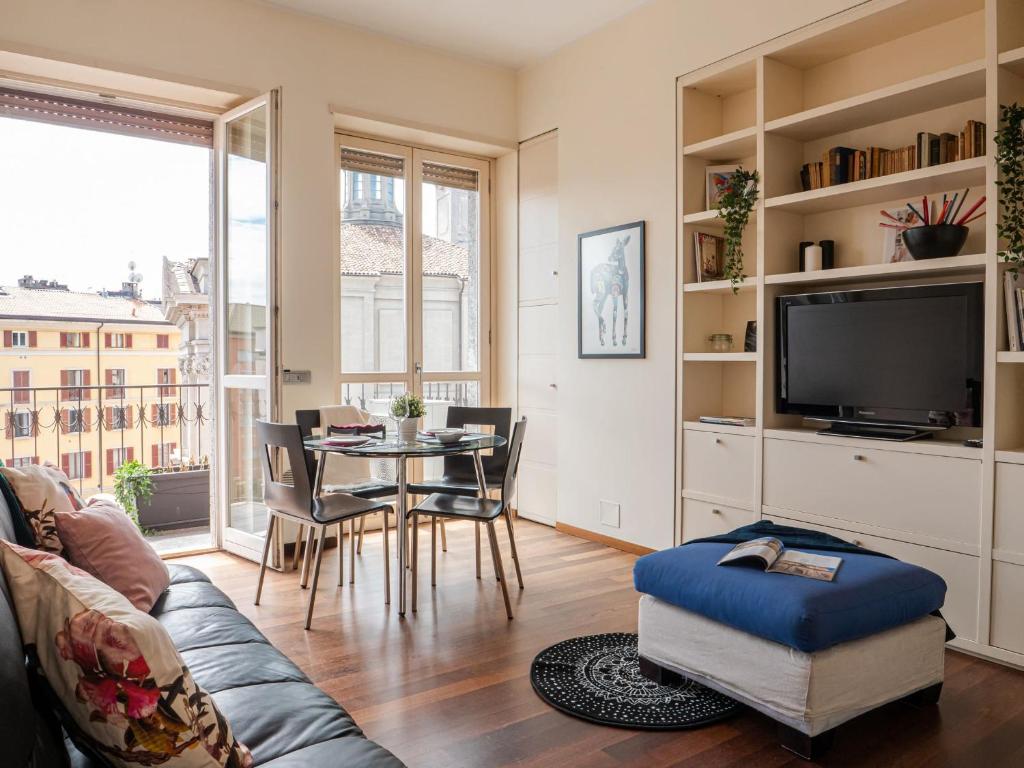 A television and/or entertainment centre at The Best Rent - Bright two rooms apartment near Cattolica University