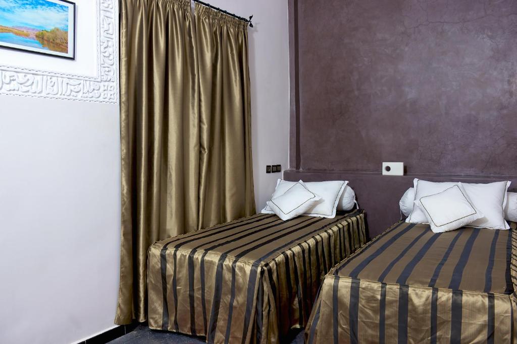 Postel nebo postele na pokoji v ubytování Hotel Azoul
