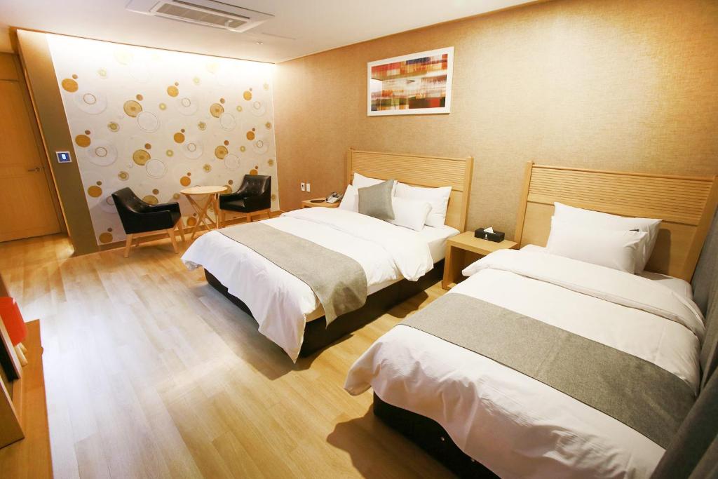 Postel nebo postele na pokoji v ubytování Paju Golden Hill