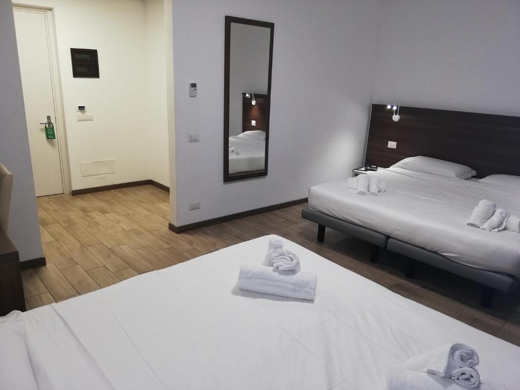Postel nebo postele na pokoji v ubytování Hotel Bocciolo