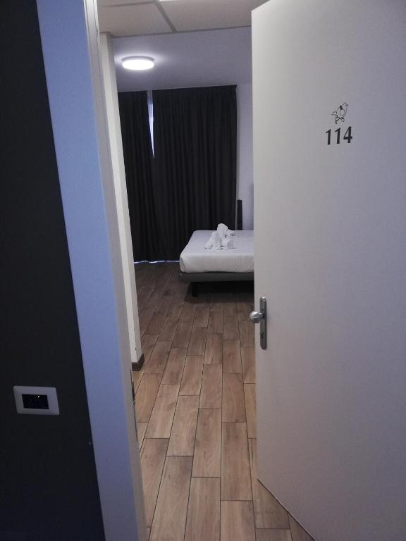 Postel nebo postele na pokoji v ubytování Hotel Bocciolo