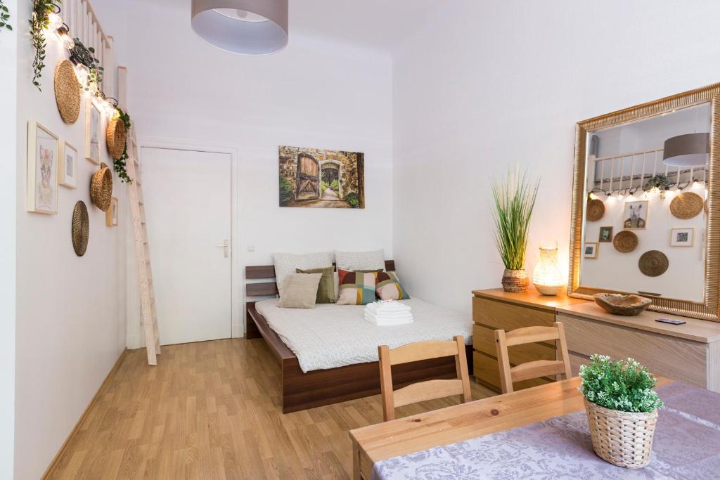 a small room with a bed and a desk at City Center Apartments in Berlin