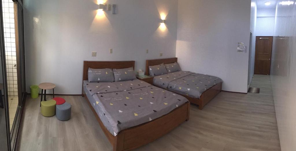 Postel nebo postele na pokoji v ubytování 瑞恒行館Reui Heng Guesthouse