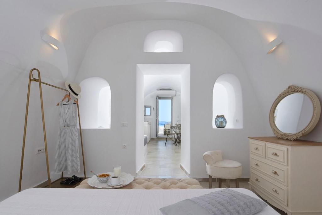 A bed or beds in a room at Amaya Sensational Villa Caldera View-Outdoor Hot Tub Oia Santorini