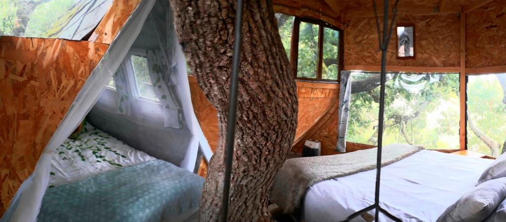 Postel nebo postele na pokoji v ubytování B&B La Cabane Insolite