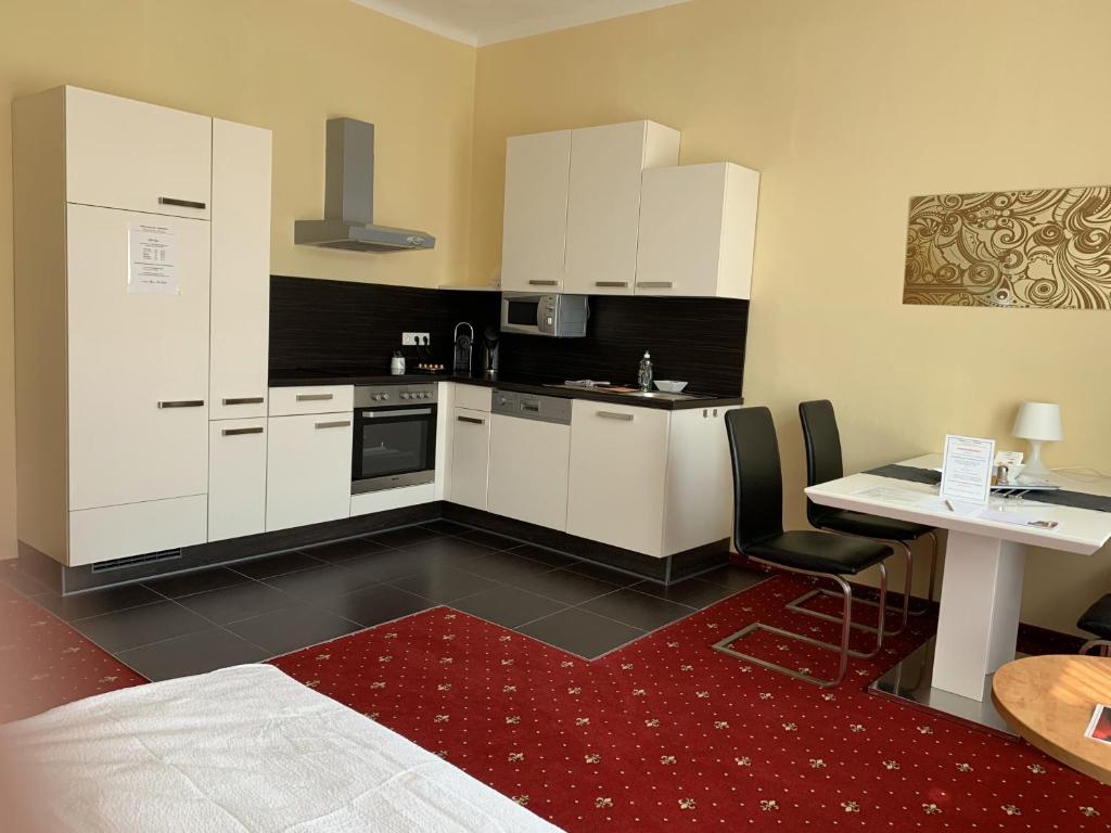 Kuchyň nebo kuchyňský kout v ubytování Residenz Royal